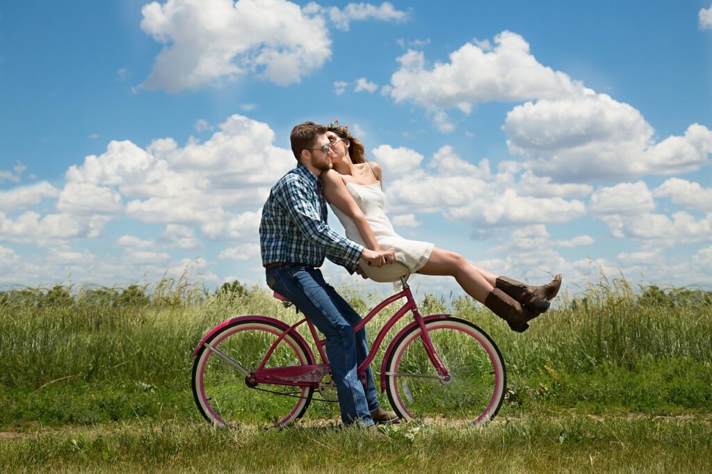 couple romance bike bicycle meadow 1718244